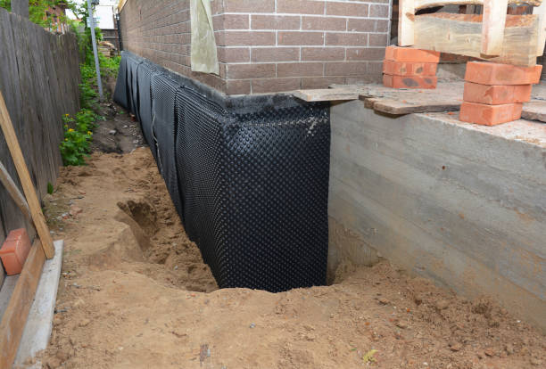 Happy homeowners after waterproofing job in Tazewell